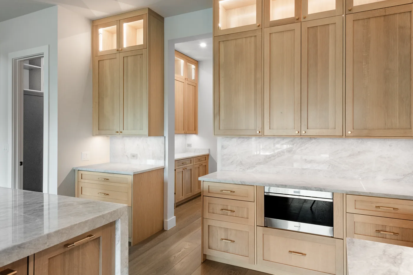 Custom kitchen cabinets with a tall pantry run in an Austin home